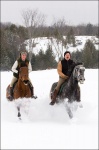 Man and Woman Horseback Riding 